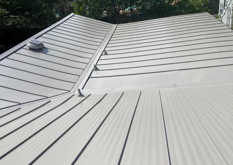Solar attic fan installed on a metal roof for Roof Ventilation in Clifton Heights